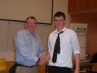 Three Rock chairman, Alan Shiel, congratulates Cian Gormley of St Benildus College