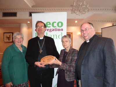 Catherine Brennan SSL, chair of ECI, presents an eco award to the Right Rev Michael Burrows. Also pictured is Janet Crampton and Rev Andrew Orr