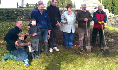 Bulb planting in graveyard beside church